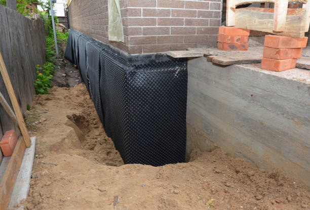 Happy homeowners after waterproofing job in Fountainville